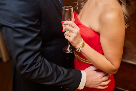 A Classy and Elegant Couple Affectionately Embracing at a Formal Evening Event Celebrationの写真素材