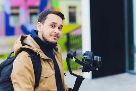 A Photographer with a Camera Gimbal captures dynamic moments in an Urban Setting