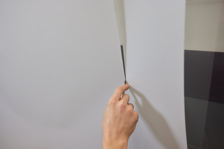 Protection of hood and front of the car with a colorless protective film.の写真素材