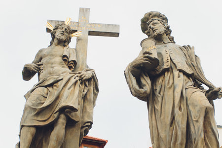 Baroque Statues on the Prague Charles Bridge on a sunny day.の写真素材