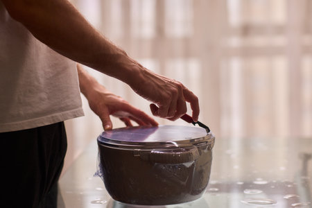 Meticulously Preparing Ingredients with Careful Wrapping for an Exquisite Cooking Experienceの写真素材