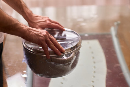 Meticulously Preparing Ingredients with Careful Wrapping for an Exquisite Cooking Experienceの写真素材