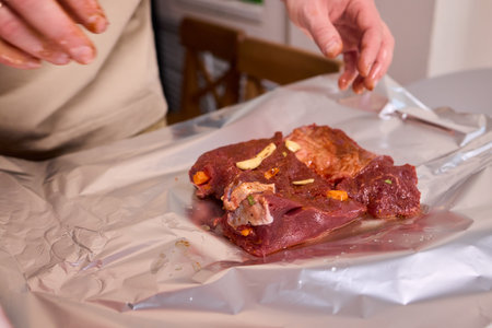 Delicious Marinated Meat Wrapped in Foil, Ideal for Grilling and Perfect for Any Mealの写真素材