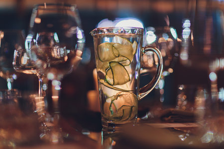 Jug of fresh cucumber water on white background.の写真素材