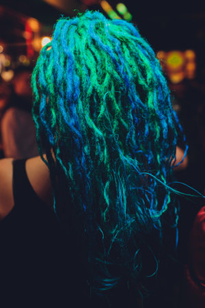 young woman with blue hair close-up back.の写真素材