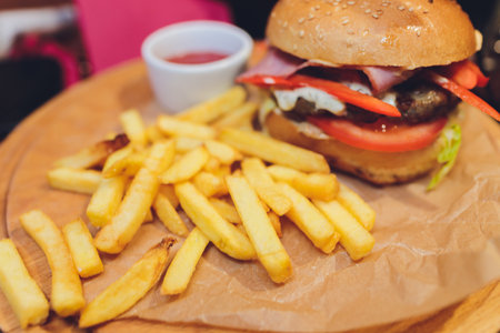 Bacon cheese burger with beef patty tomato onion.