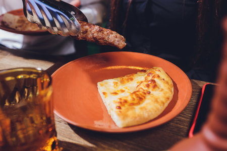 Georgian food - meat barbecue dishes on a bread plate.の写真素材