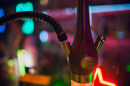 Person holding a hookah at an eventの写真素材