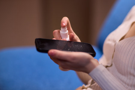 Hand Sanitizing Phone Interaction A crucial aspect of maintaining health and hygiene dailyの写真素材