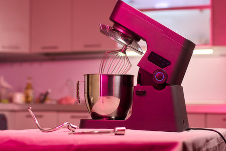 A Modern Kitchen Mixer is Actively in Use for Whipping Up Delicious Baking Creations