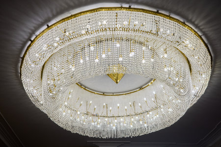This design features a unique ceiling concept with modern lighting, enhancing aesthetic appealの写真素材