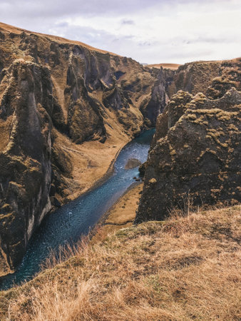 Iceland stunning landscape features mesmerizing waterfalls and majestic snowcapped mountainsの写真素材