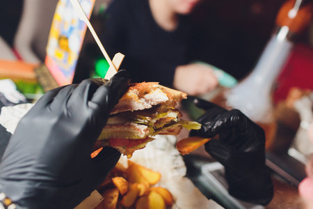 Savor a delicious gourmet burger paired with crispy fries for an unforgettable dining experienceの写真素材