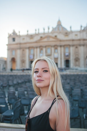 A Stylish Woman Taking Time to Relax in a Beautiful Historic Roman Landscape Settingの写真素材