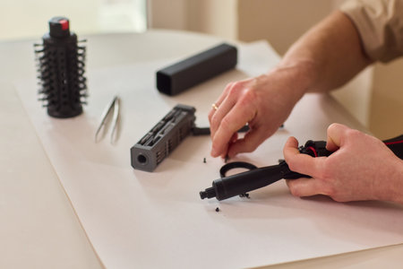 Hands of skilled workers diligently engaged in the intricate repair of mechanical devices