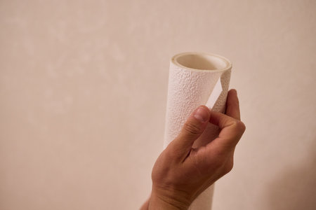 Approaching the Task of Applying Wallpaper with Care for a Beautiful and Stunning Interiorの写真素材