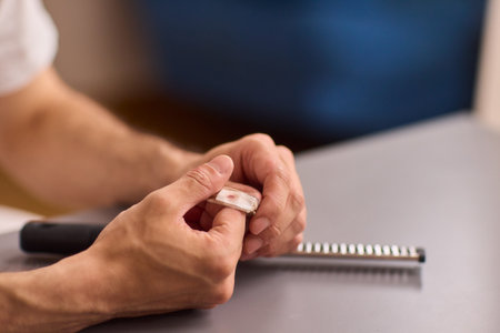 Healthcare Preparations Hand Holding Essential Medical Supplies for Effective Careの写真素材