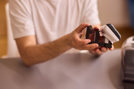 Unboxing a brand new handheld vacuum cleaner attachment, perfect for efficient cleaning tasksの写真素材