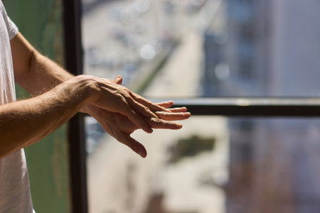 Applying Skincare Cream Daily on Hands for Achieving Healthy, Hydrated, and Radiant Skin Careの写真素材