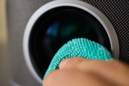 It is important to clean a projector lens carefully using a microfiber cloth for best resultsの写真素材