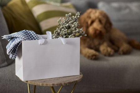 An Adorable Dog Snuggled Up and Nestled in a Decorative Basket in a Cozy and Inviting Settingの写真素材