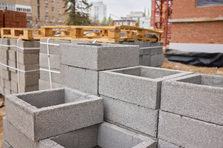 A closeup image of Stacked Bricks showcased in a dynamic Construction Environmentの写真素材