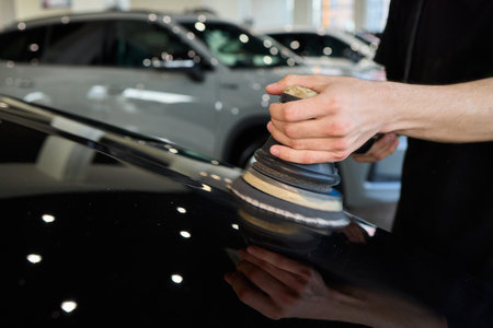 A Detailed Close Up of the Car Polishing Process in the Field of Automotive Detailingの写真素材