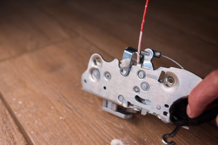 Hands Engaged in the Process of Performing Automotive Interior Repairs Effectively