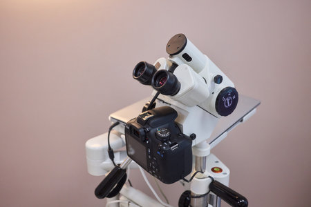 A sophisticated microscope equipped with a camera, providing enhanced observation capabilitiesの写真素材