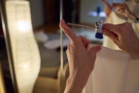 Delicate Dressing Preparing an Elegant Outfit in Soft, Cozy Lighting for Daily Wear and Style