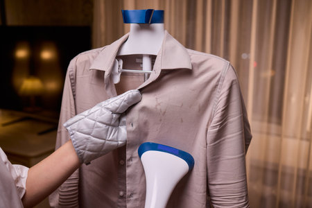 Steam your clothes at home for a fresh and stylish look thats easy to maintainの写真素材