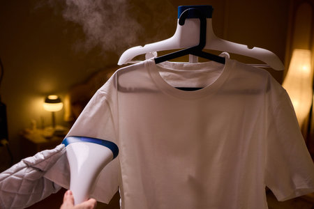 Steam your clothes at home for a fresh and stylish look thats easy to maintainの写真素材