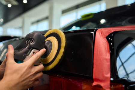 A Detailed Close Up of the Car Polishing Process in the Field of Automotive Detailingの写真素材