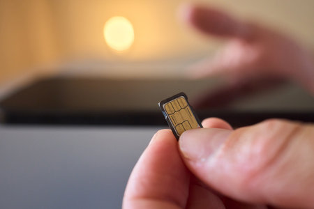 Detailed Process of Installing a SIM Card Utilizing Various Smartphone Components and Accessoriesの写真素材