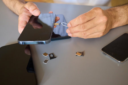 Detailed Process of Installing a SIM Card Utilizing Various Smartphone Components and Accessories