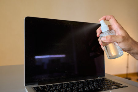 Properly cleaning your laptop screen is essential for optimal performance and clarity during useの写真素材