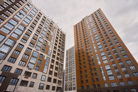 A bustling Construction Site showcasing Cranes, Building Framework, and full activity all aroundの写真素材