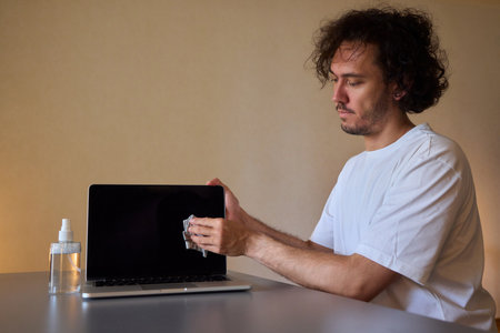 Properly cleaning your laptop screen is essential for optimal performance and clarity during useの写真素材