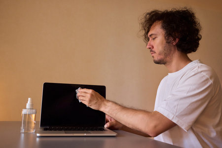 Properly cleaning your laptop screen is essential for optimal performance and clarity during useの写真素材