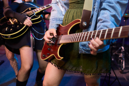 An Energetic and Enthralling Guitar Performance by Trendy Musicians on a Vibrant Stage