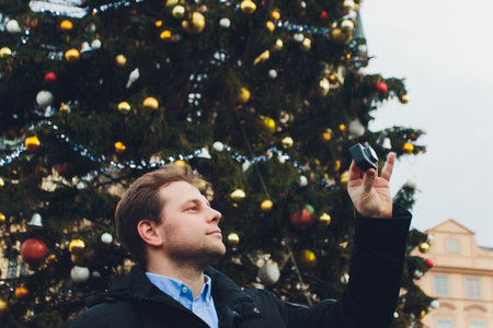hands holding a power bank being and action camera