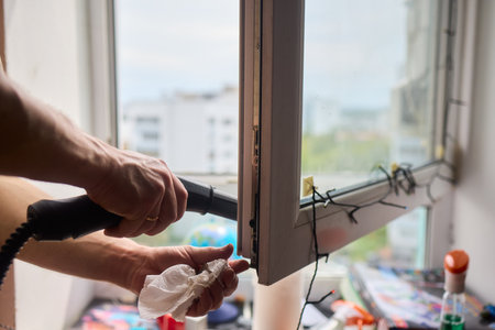 Efficiently Cleaning Windows with Advanced Steam Technology for a Spotless Crystal Clear Viewの写真素材