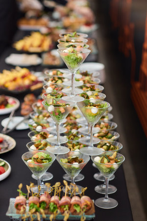 An Elegant Assortment of Gourmet Desserts and Savory Snacks Beautifully Arranged on Tableの写真素材