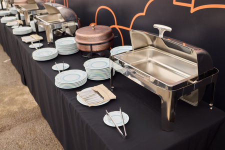 An Elegant Dining Setup Featuring a Silver Cloche and a Unique, Sophisticated Ambiance