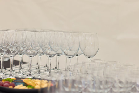 An Elegant and Charming Lineup of Crystal Clear Champagne Flutes Featured at the Eventの写真素材