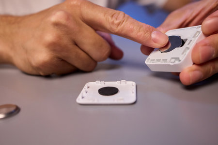 Hands Engaging with Technology Interactive Device Assembly and the Art of Collaborationの写真素材