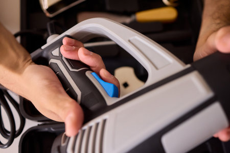 Hand Operating a Sleek and Modern Grooming Device Designed for Personal Care and Hair Styling