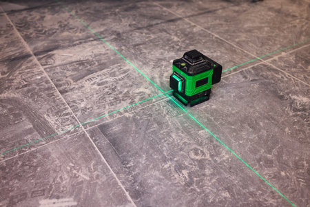 The Laser Level Tool is crucial for precise alignment in construction projects and tasksの写真素材
