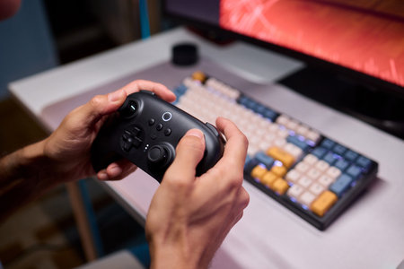 Enjoying an exciting gaming session with a controller and large screen for immersive gameplay