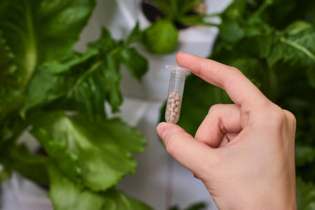Holding a Seed Vial in a Nurturing Indoor Garden Filled with Vibrant Life and Growth